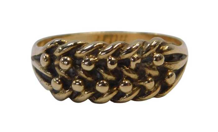A 9ct gold keeper ring, the flat ball design, on ribbed shoulders, Birmingham 1914, ring size Q&frac12;,...