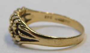 A 9ct gold keeper ring, the flat ball design, on ribbed shoulders, Birmingham 1914, ring size Q&frac12;,... - 2