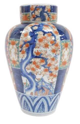 A Japanese Imari-pattern porcelain ginger jar and cover, with interior lid, restored, 33cm.