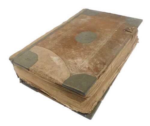 An 18thC Holy Bible, calf bound with metal mounts, printed by John Baskett, Oxford, 1739.