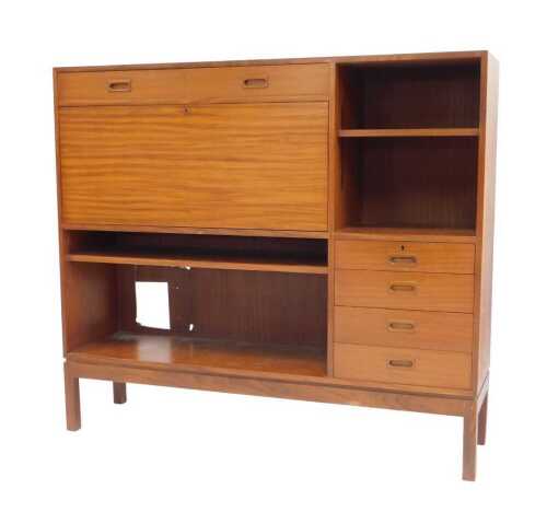 A mid 20thC teak bureau cabinet, probably by Remploy, with an arrangement of six drawers, one...