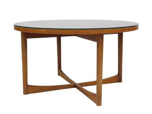 A McIntosh teak coffee table, the circular top with radiating veneers, on turned supports with X...