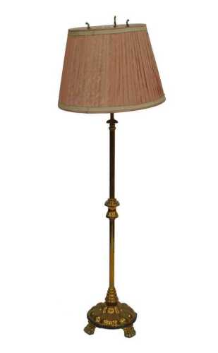 A late 19th/early 20thC brass floor lamp, with scroll support to the top cylindrical column, and...