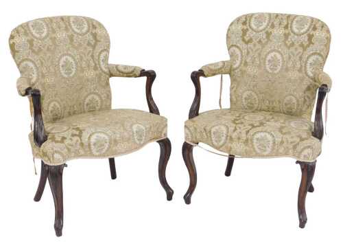 A pair of 18thC mahogany framed open armchairs, of Hepplewhite design in the French taste, with...