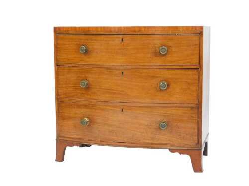 A 19thC mahogany and satinwood crossbanded bow fronted chest of drawers, with an arrangement of...