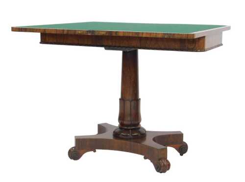 A William IV rosewood card table, the rectangular top with rounded corners and a gadrooned...