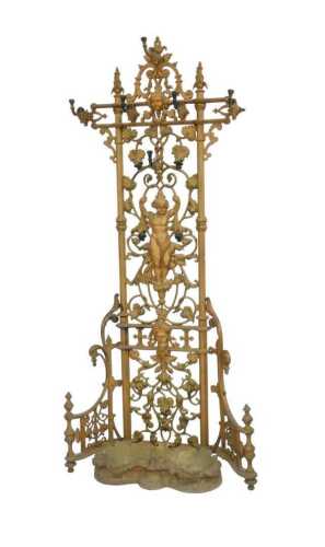 A Victorian Coalbrookdale cast iron hall stand, decorated with a central putto, male and female...