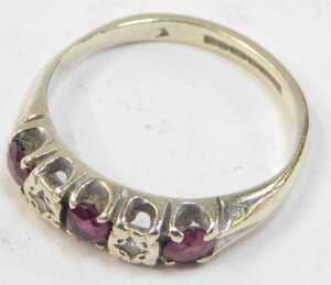 A 9ct white gold ruby and diamond half hoop dress ring, set with three round brilliant cut... - 2