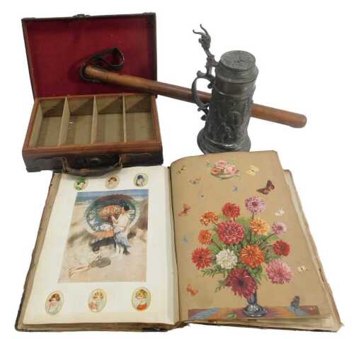 A 1930s scrap album, together with a brown leather case, the hinged lid enclosing four green...