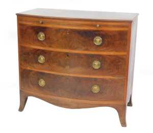 A George III Sheraton mahogany bow front bachelor's chest, with satinwood banded top, brushing...