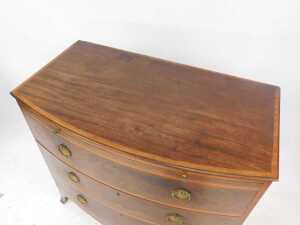 A George III Sheraton mahogany bow front bachelor's chest, with satinwood banded top, brushing... - 3