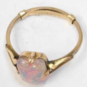 A single stone dress ring, set with imitation opal, on a rolled gold band, with ring sizer, ring... - 2