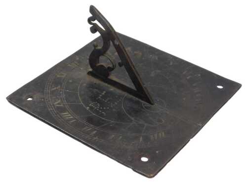 A mid 18thC brass sundial, with a square dial plate and fret-cut scroll design gnomon, the plate...