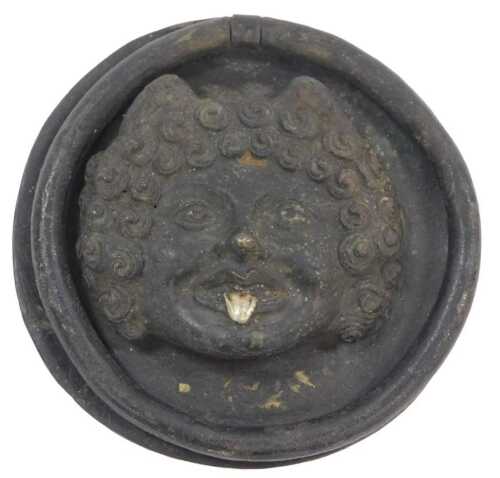 An 18thC or earlier Romanesque bronze door boss, cast with the head of Medusa in relief, with...