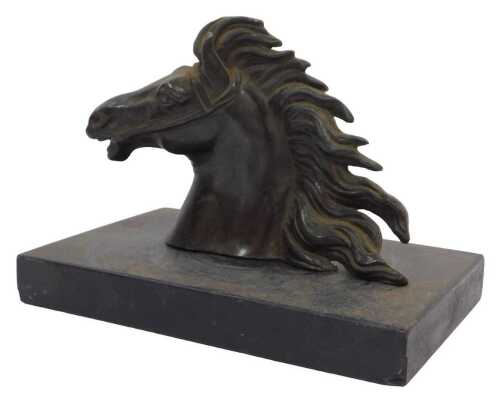 A late 19thC bronze patinated sculpture of a horse's head, with flowing mane, white metal,...