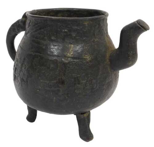 An Archaic Chinese bronze spouted water vessel (He), raised on three feet (one detached), with a...