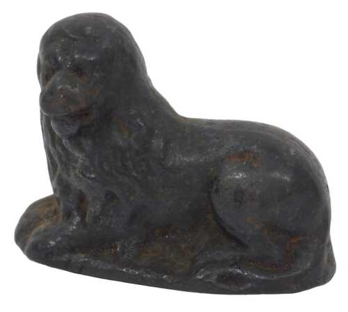 An 18th/19thC cast-iron figure of a recumbent lion, 6cm high.