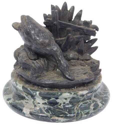 A 19thC bronze Vesta striker, in the form of a duck with an outstretched neck drinking from a...