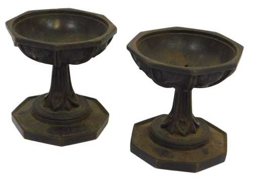 A pair of 19thC bronze censers, of octagonal pedestal design, the bowls with raised scroll...
