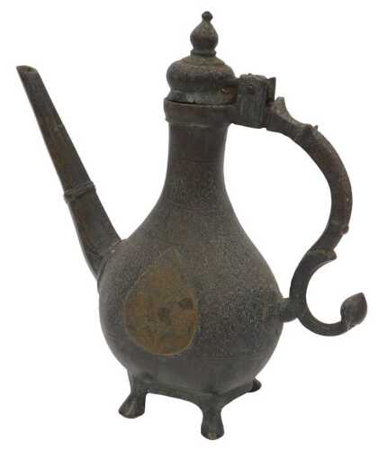 An 18th/19thC Northern Indian Islamic brass ewer, of pear-shaped design with slender octagonal...