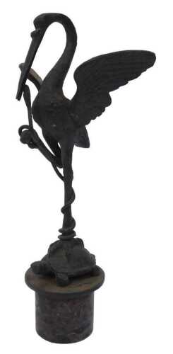 A 19thC bronze figure of a crane with serpent, standing on a tortoise, on a rouge marble plinth...