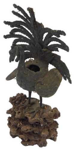 An 18th/19thC Chinese bronze censer figure of a peacock, with raised tail feather, lacking cover,...