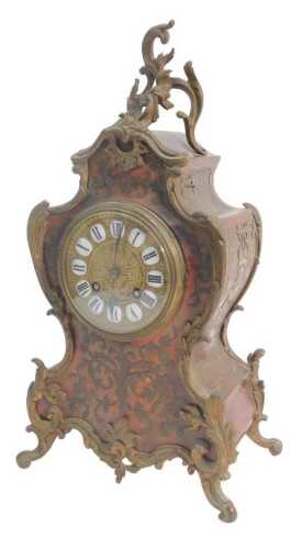 A late 19thC Louis XV style boulle mantel clock, the circular brass dial bearing enamel Roman...