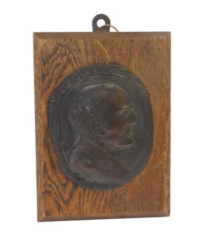Y - 20thC English School. Reginald Carew Glanville, oval bronze portrait plaque facing sinister,...
