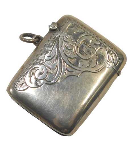 A George V engraved silver Vesta case, decorated with scrolls, Birmingham 1918, 0.93oz, 5cm x 4cm.