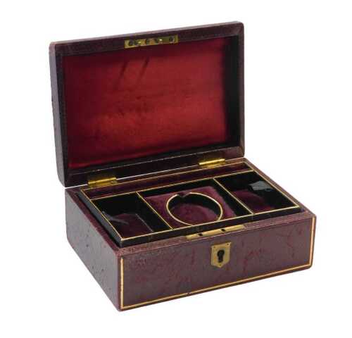 An Edwardian tooled and gilt leather jewellery box, with fitted interior, 18cm wide.