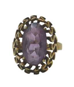 An amethyst dress ring, the oval cut amethyst in a six claw raised basket setting, with S design...