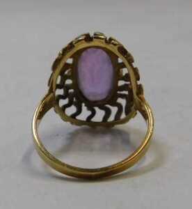 An amethyst dress ring, the oval cut amethyst in a six claw raised basket setting, with S design... - 2
