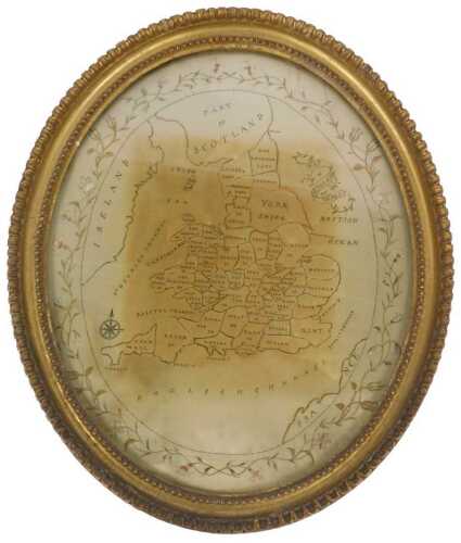 A 19thC embroidered silk map of England and Wales, within a floral decorated border, oval, 39cm...
