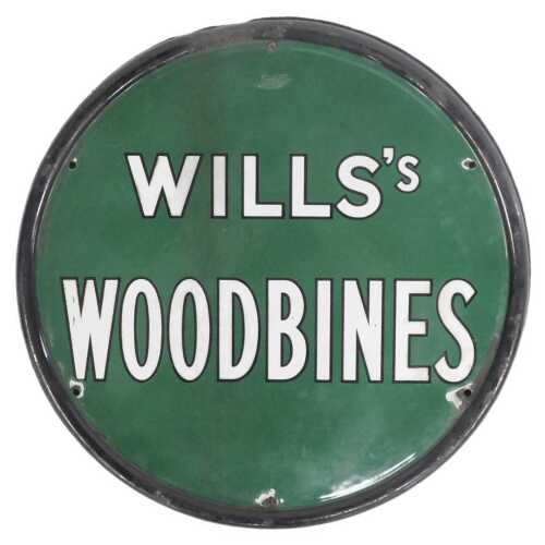 A Wills's Woodbines enamel double sided sign, of circular form, with white lettering against a...