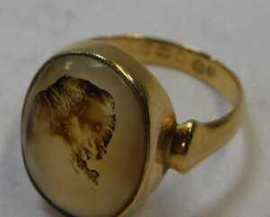 An 18ct gold moss agate dress ring, the oval-cut moss agate with visible natural inclusions, in... - 2