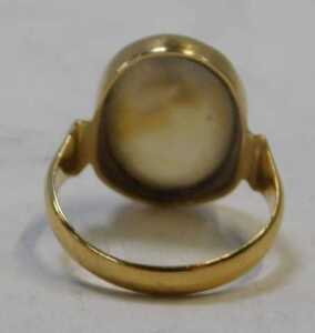 An 18ct gold moss agate dress ring, the oval-cut moss agate with visible natural inclusions, in... - 3