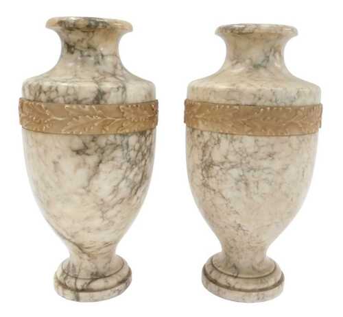 A pair of late 19th/early 20thC variegated marble vases, each of cylindrical shouldered form,...