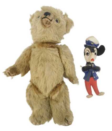 An early 20thC blonde straw filled Teddy bear, with velvet pads and nose, 32cm high, together...