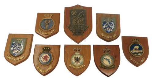 A group of Naval and Royal Air Force plaques, each mounted on an oak shield back, the largest...