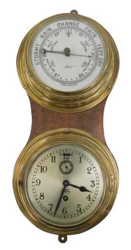 A Barkers of Kensington wall-mounted brass-cased barometer and clock, the barometer with a white...