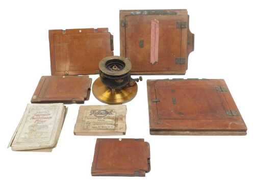 A brass and black painted metal sextant stand, 13cm high, together with various wooden...