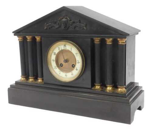 A Victorian black slate mantel clock, the circular dial with an enamelled chapter ring bearing...