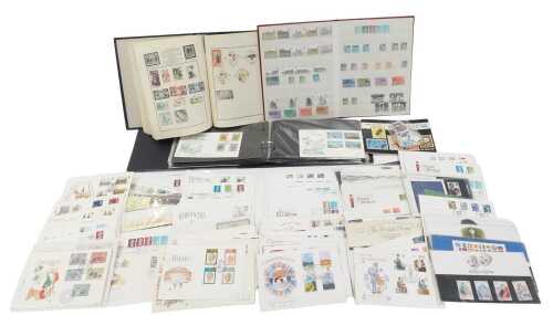 First day covers, loose, together with a Meteor stamp album containing 20thC and GB postally...