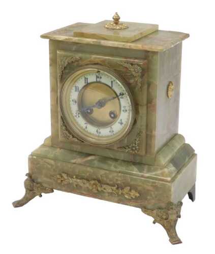 A Victorian onyx cased mantel clock, the circular dial with a cream enamel chapter ring, bearing...