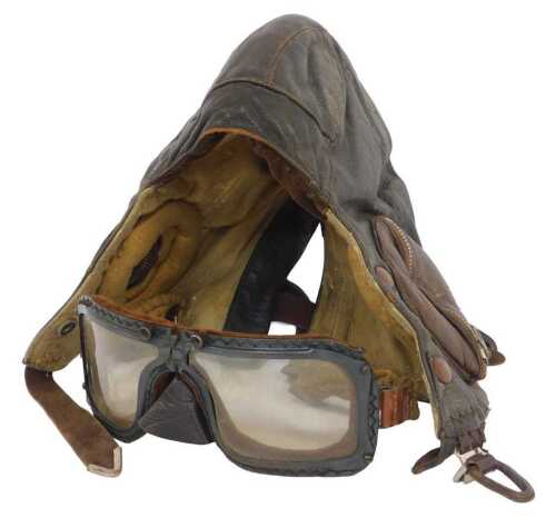 A WWII-era Air Ministry brown leather flying helmet, size 2, bearing a label Made by Frank Bryan...