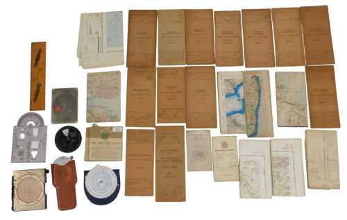 A group of navigation-related instruments, including a Jeppesen slide graphic computer, model...