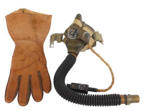 A WWII oxygen mask, size medium, together with a single Air Ministry multi-tonal brown flying...