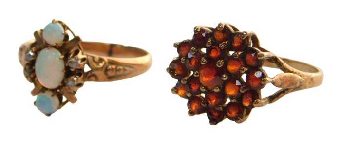 Two 9ct gold dress rings, comprising a 9ct gold garnet cluster ring, in a three layered raised...