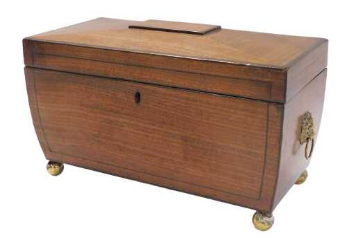 A Regency mahogany and ebony strung sarcophagus shaped tea caddy, the domed top enclosing a...