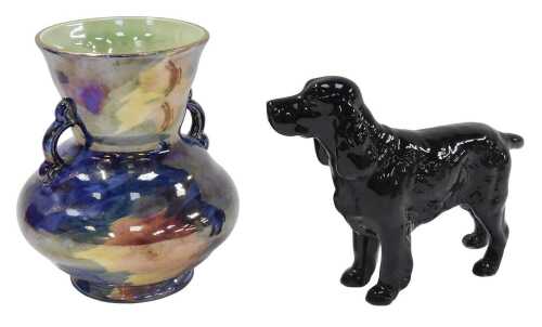 A Beswick figure of a black Spaniel, 17cm wide, and a Maling multicoloured lustre two-handled...